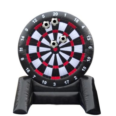 Inflatable dartboard with multiple darts embedded in the target.